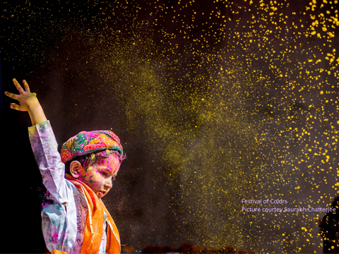 A boy celebrating holy; holy colors; Indian Festivals; Festive color captured in the photographs;