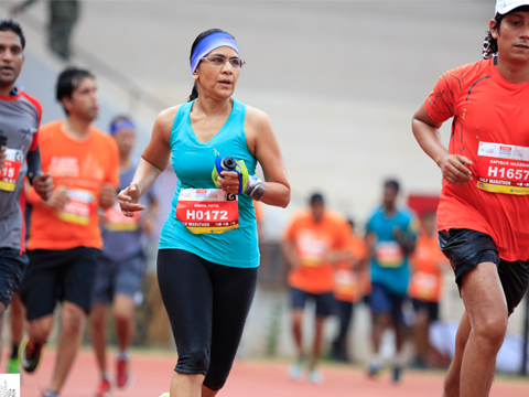 Cyclists taking turn on the way back to Finish line; Sports photography;